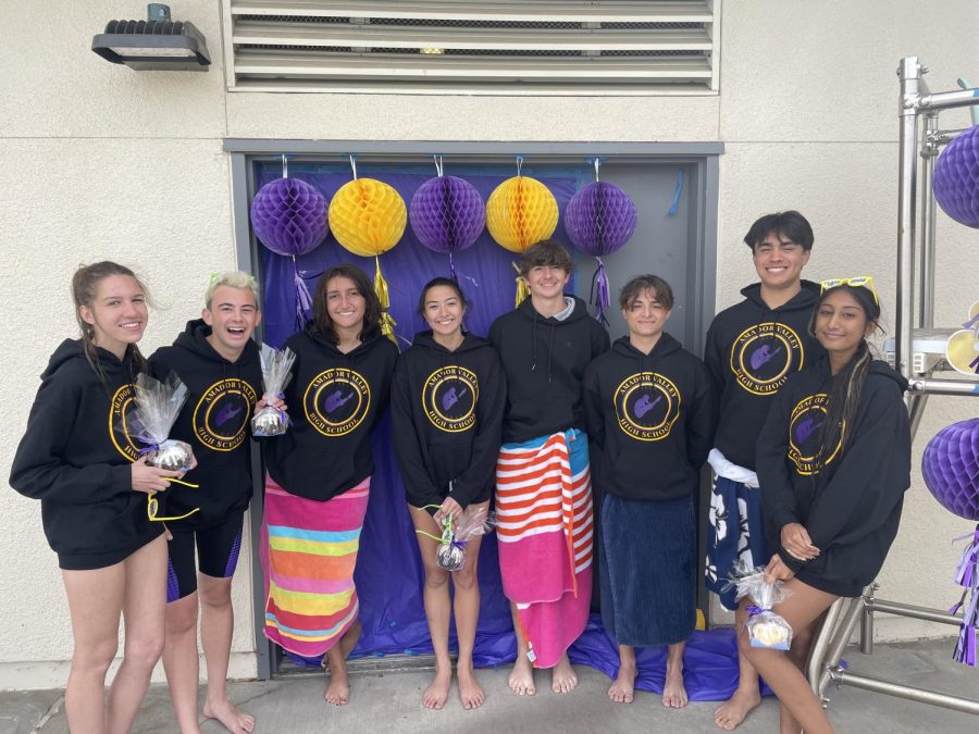 The dive seniors standing side by side on their senior night.