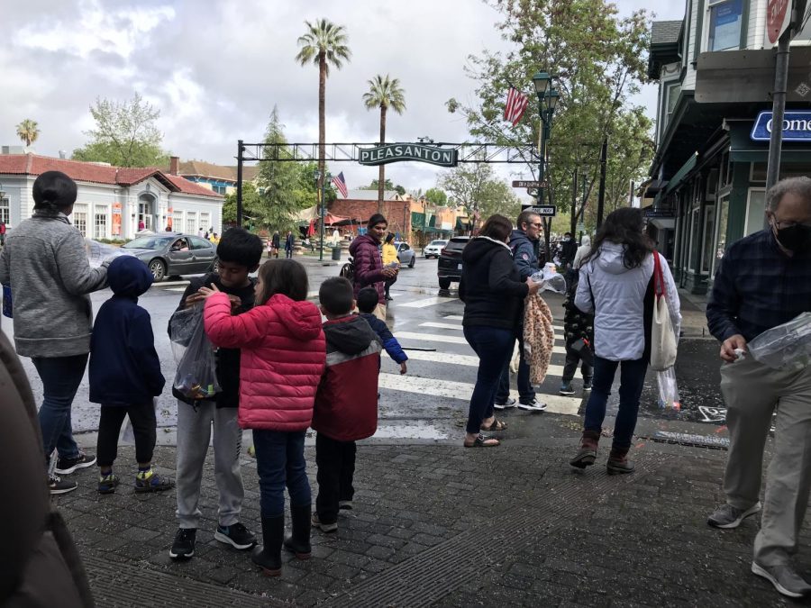 Families tour Main Street and visit local businesses participating in the event.