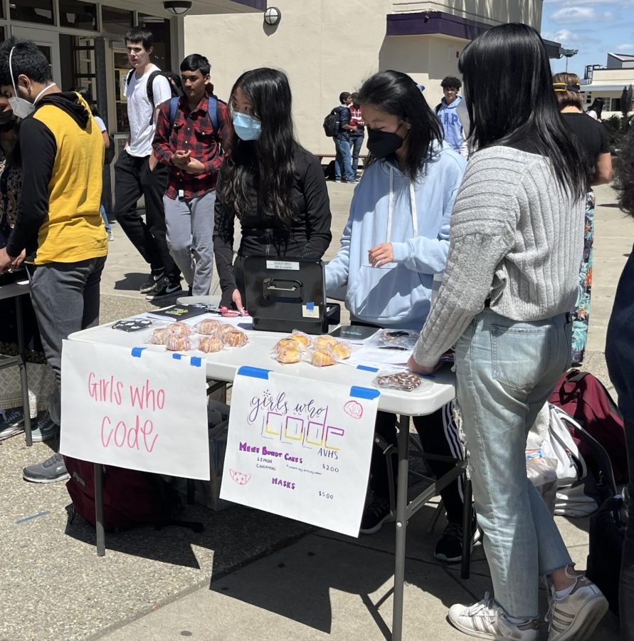 Girls Who Code members sell homemade bundt cakes for fundraising.