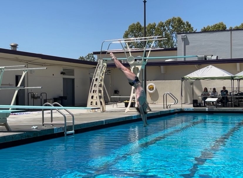 Scotty Garman ('22) taking a dive with perfect form at the Amador pool.