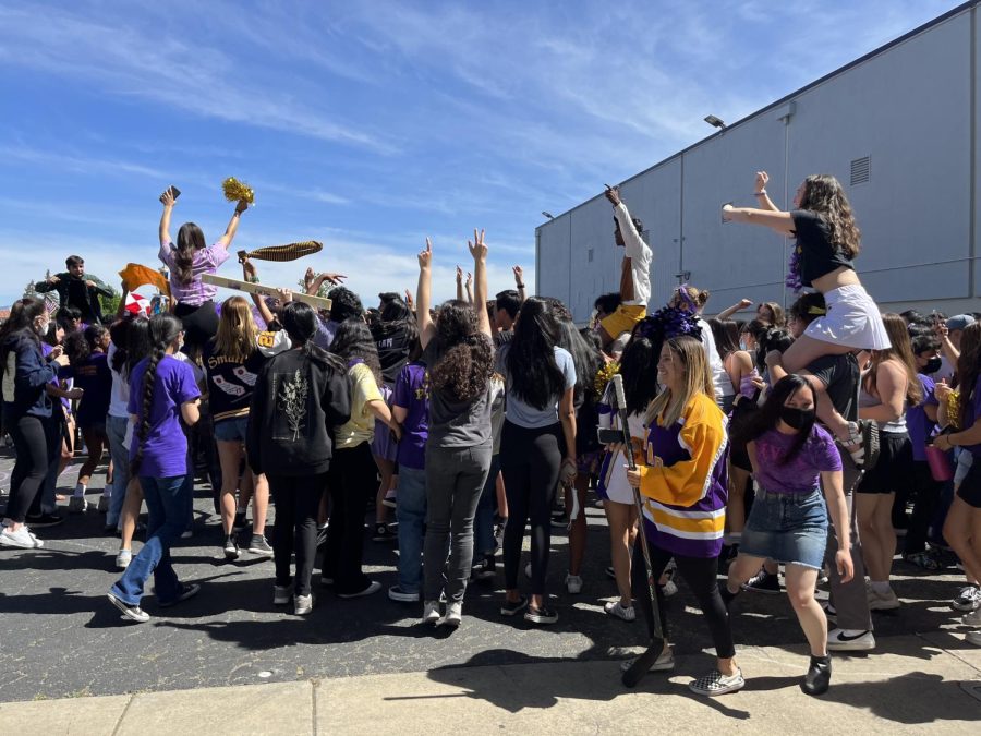 All the students race towards the field to be in the remaining seconds of the video. 