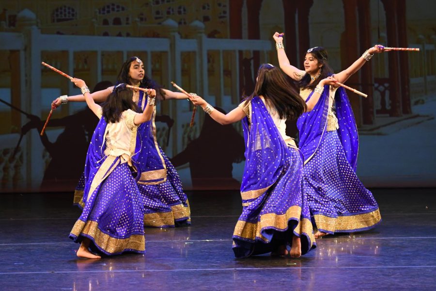 Bollywood dancers perform in traditional clothing and props. (Jiawen (Sarah) Yan)