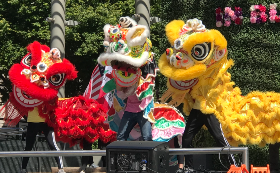 Multicolored lion dancers from Formosa Association of Student Culture Ambassadors (FASCA) dramatize the San Francisco Union Square stage.