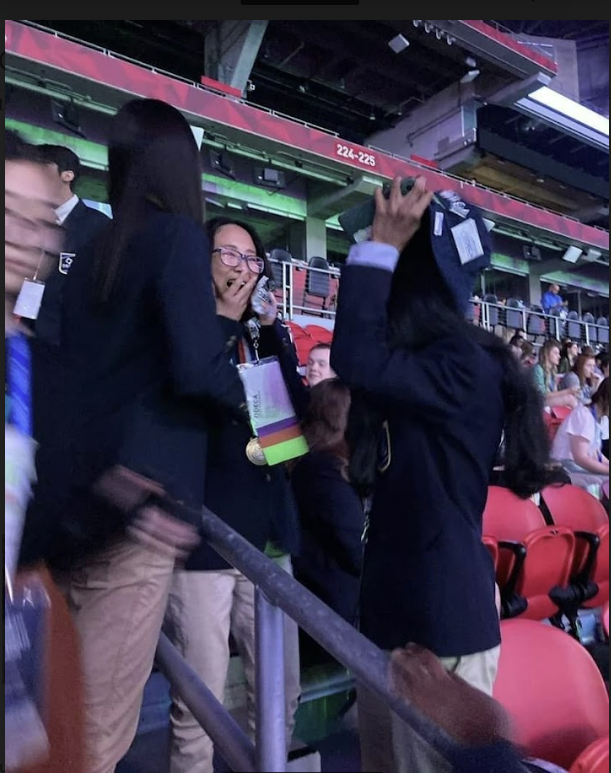 Zhang is shocked when her name is called on the loudspeakers at the Chase stadium in Atlanta. 
