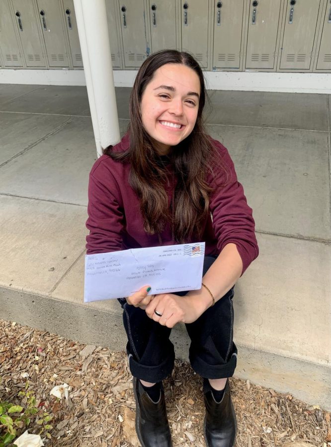 Ashley Torres (‘22) poses with her freshman health letter and believes that a lot of what she wrote about still resonates with her today.