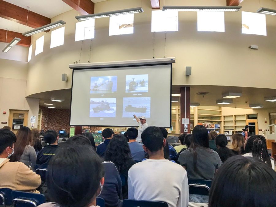 Aided with a visual presentation, Vietnam War veteran Bill Murphy speaks about his time in the Navy.