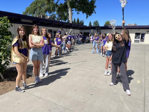 The lacrosse team prepares to smile and wave as the camera flies by to record all activities at Amador.