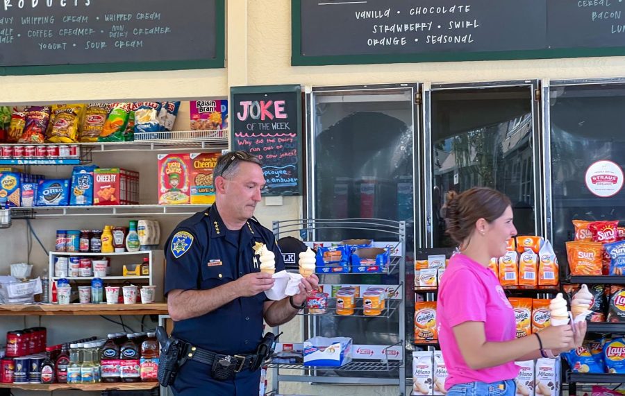 Pleasanton cops helped Dairy workers deliver ice cream to waiting customers.

