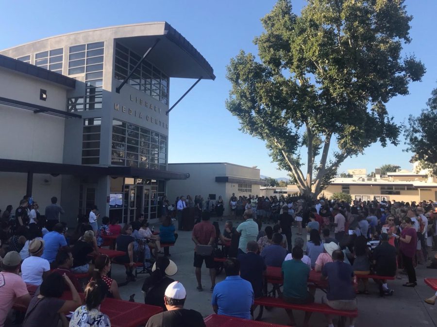 Attendees gathered in front of the library to hear opening remarks from Amador and PUSD staff.