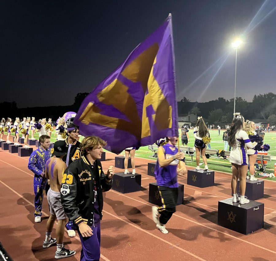 AV Don Squad raises the AVHS flag to show Amador school spirit as they hype up the crowd.