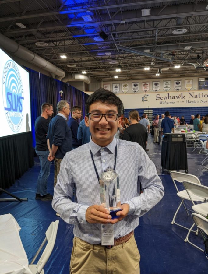 Gottschalk holds the second place trophy won by Amador UAVs at the international AUVSI competition. 
