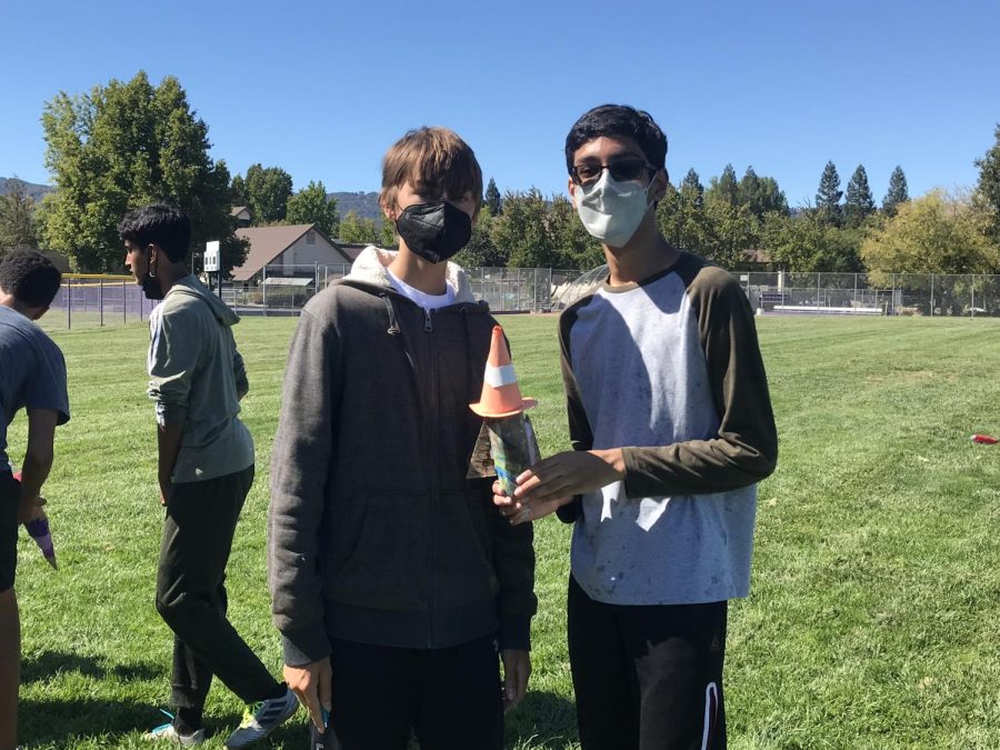 Dashell Finn (‘25) and Akarsh Singh (‘25) pose with their group’s personalized rocket.