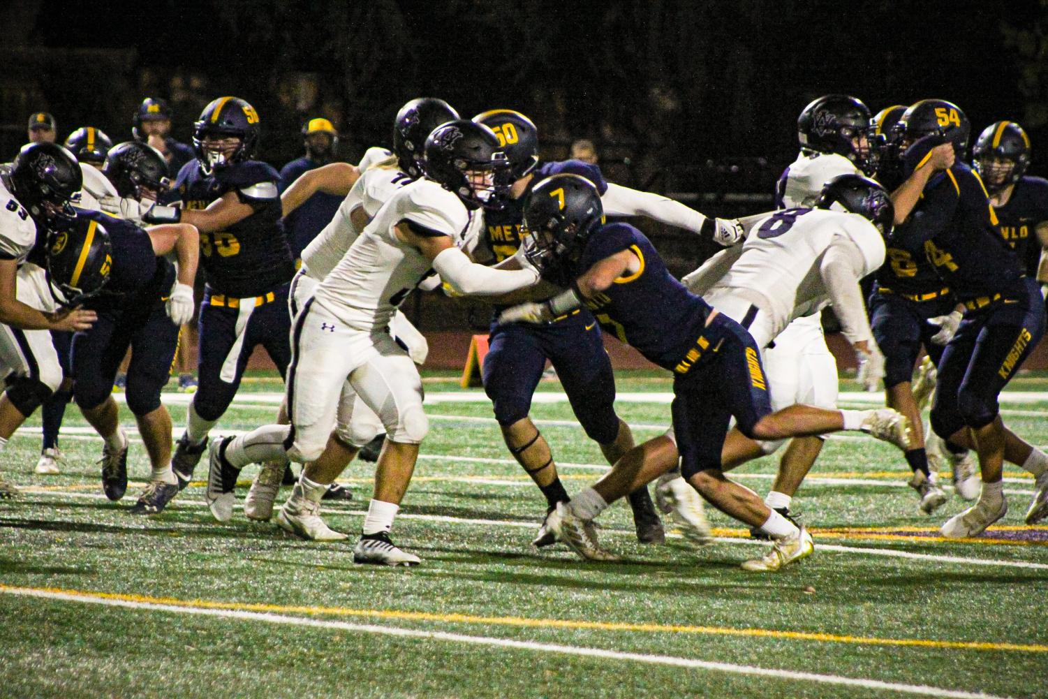 Dons go white out on a Saturday night football game against Menlo School