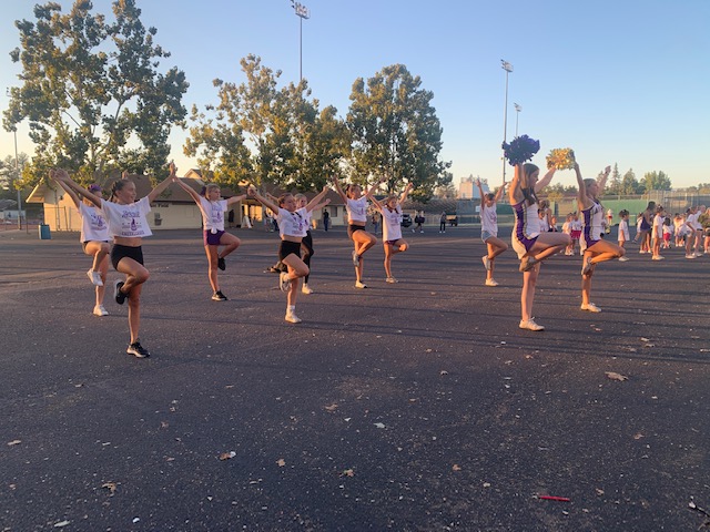 Aspiring cheerleaders perform at freshman football game