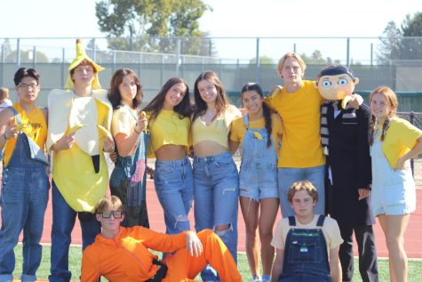Don Squad members pose in their Minions dress-up attire for the Homecoming rally.