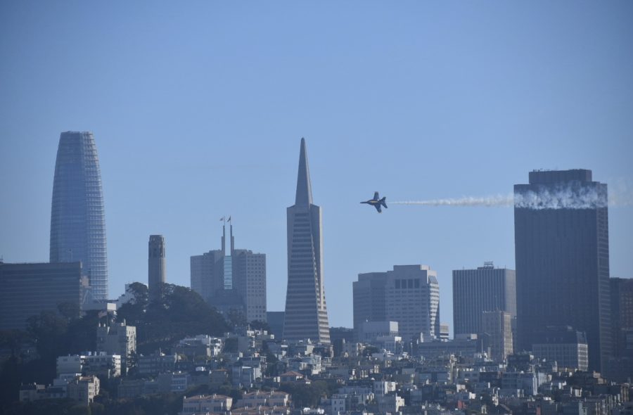 A single solo Blue Angel flies over San Francisco.
