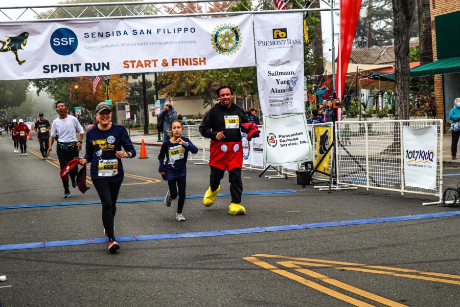 Participants pass the finish line after a grueling 25-minute marathon.