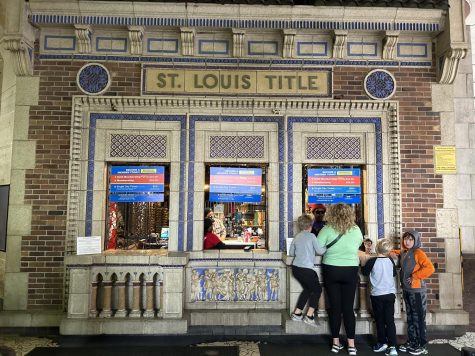 Upon entry, families purchase their tickets at the three tiled windows. 