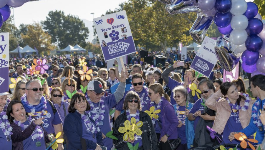 Team+Stacy+from+the+2021+East+Bay+Walk+to+End+Alzheimer%E2%80%99s+is+seen+at+the+walk+with+their+T-shirts+and+signs%2C+among+balloons+and+many+other+crowds.+This+years+event+aims+to+raise+more+funds+to+help+in+disease+research.