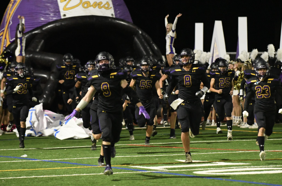 Amador+Valley+seniors+Kevin+Albright+%28%239%29%2C+Brady+Nassar+%28%238%29%2C+and+Jacob+Cazella+%28%2323%29+lead+the+Dons+out+to+the+field+on+senior+night.+