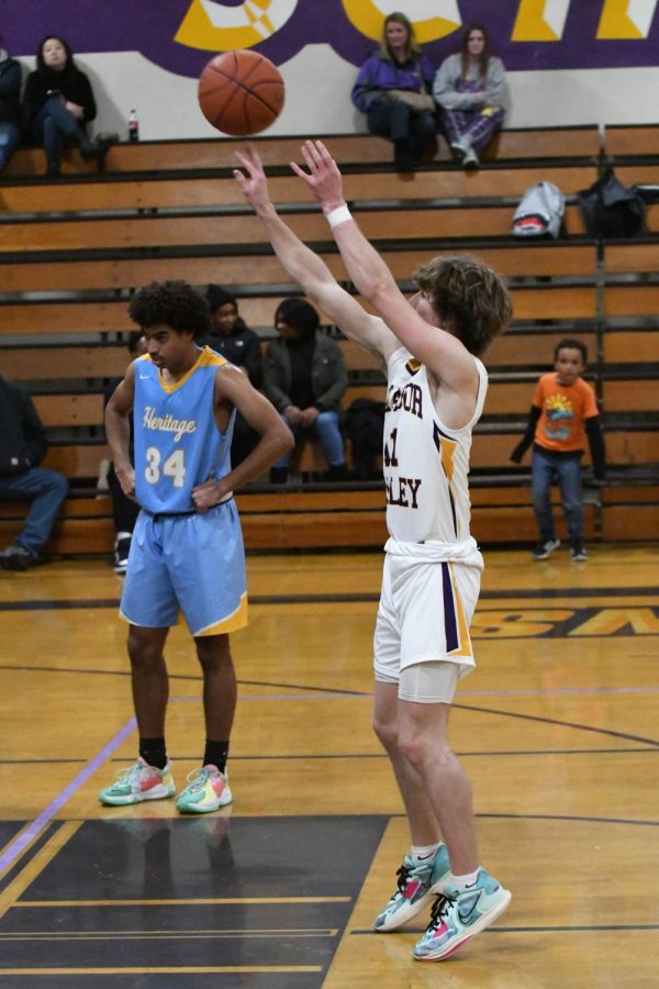 Colton Cash (23) shoots a free throw.