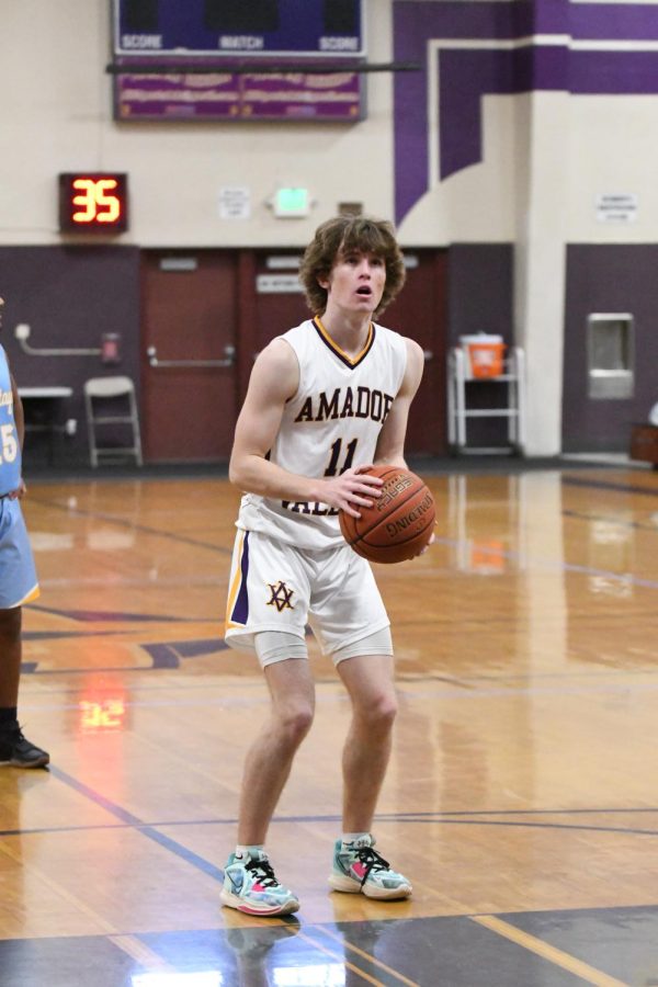 Colton Cash (23) stands in preparation of his shot. 