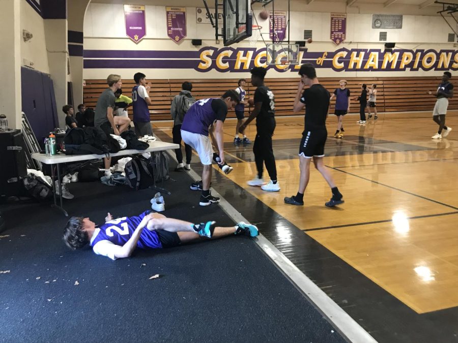 Cannon DiFraia (#24) stretches out on the floor to warm up for practice. He is one of the three transfers on Amadors roster this season.