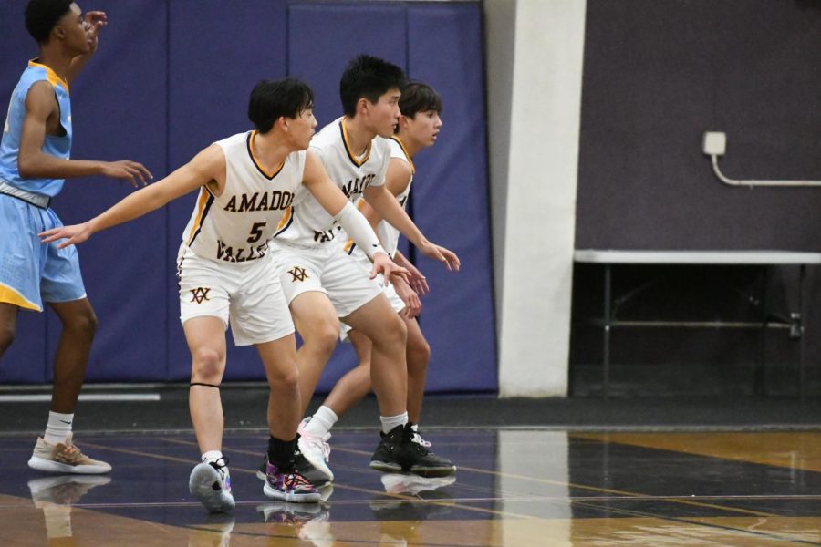 Jesse Huang (23), Alex Liu (24), and Tyler Cheng (23) stand guard for the other team.