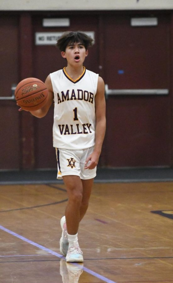 Tyler Cheng (23) calls for assistance while bringing the ball down the court.