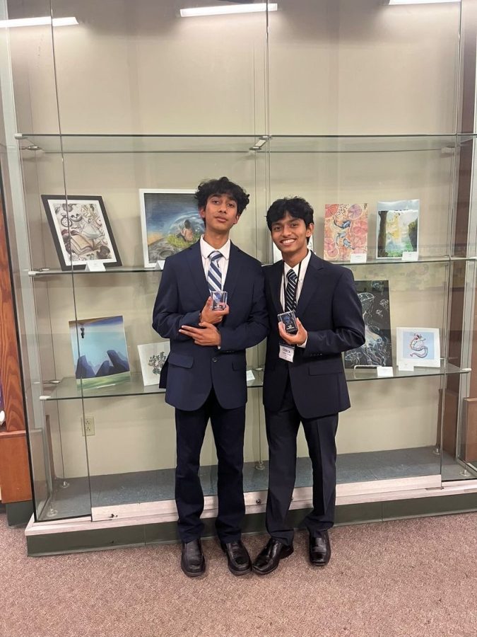 Minicon winners Arnav Dhole (‘25) and Varadan Kalkunte (‘25) pose with their first place trophies.