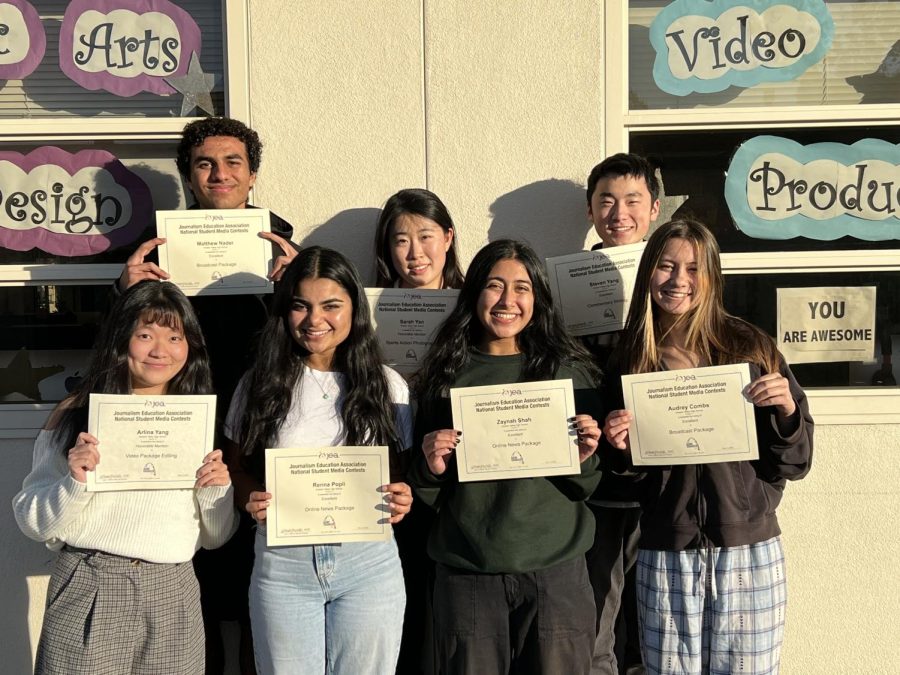 Upon arriving home, the eight winners hold their official JEA certificates. (Not pictured: Albertine Combs)