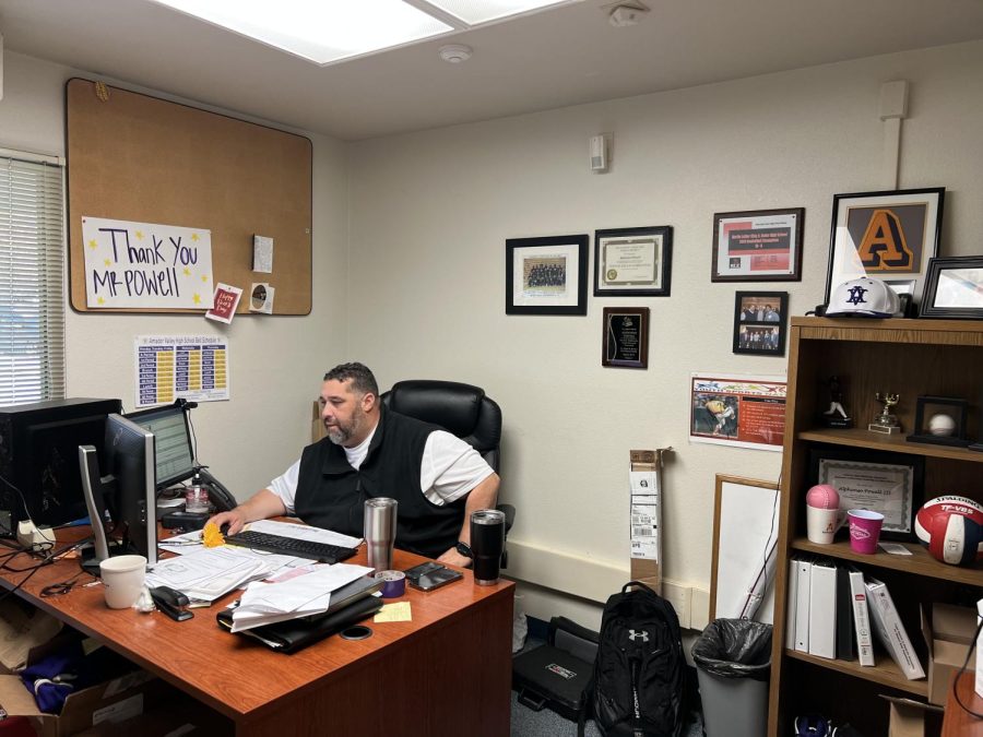 Alphonso Powell decorates his office with sports memorabilia and notes from students.