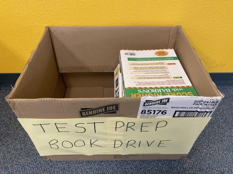 Test prep books were collected in cardboard boxes in the front office.