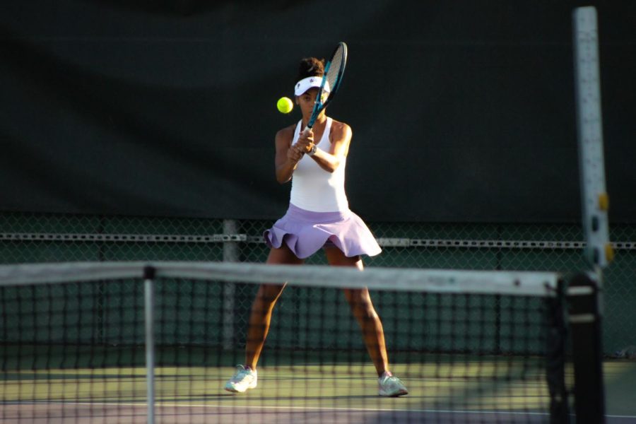 Montana Parkinson-Lubold (24) stays focused as she strikes a backhand in a match against Monte Vista.