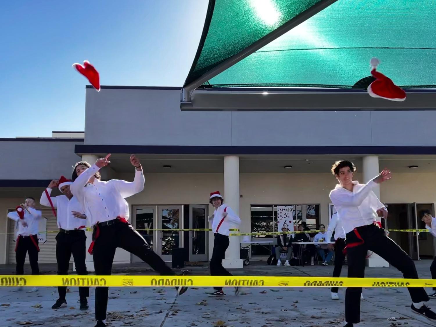 Mr. Amador introduces pageant participants with holiday dance