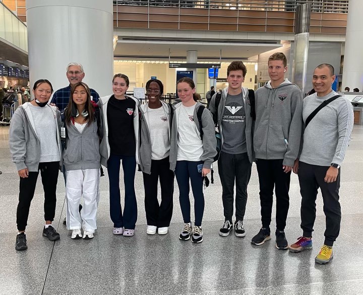 Hayden Tupper (‘23), third from right, poses for a photo with the Pleasanton Seahawks World Cup team in the Berlin Airport.