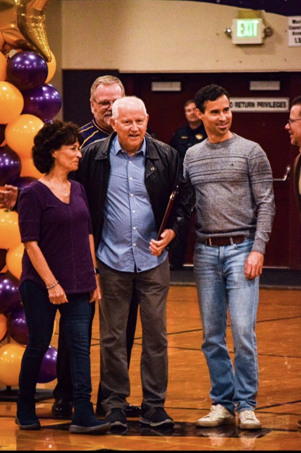 Don Underwood receives his plaque and inauguration during the halftime ceremony. 