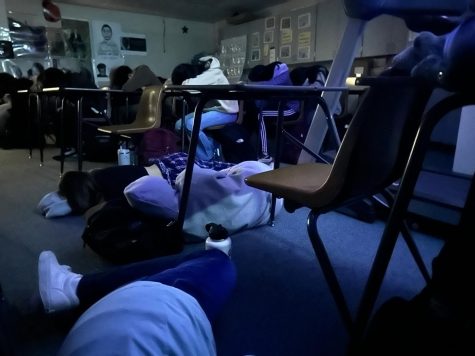 Students lowered their heads onto their desks and the floor to take advantage of the sleeping period.