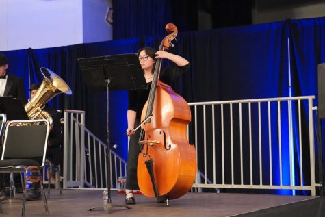 Mya Lee (‘23) stands tall as she plays the bass.