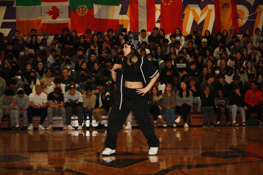 Savana Robles (24) performs a hip-hop dance solo at Rally A of Donversity in the large gym. 