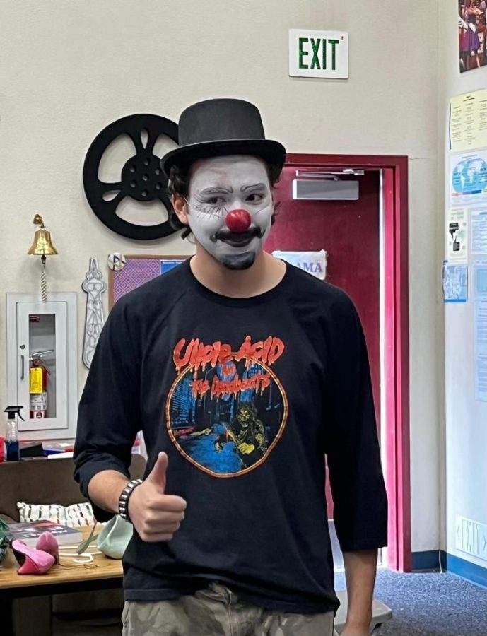 Garrison Garcia (23) gives a thumbs up to stepping out of his comfort zone with clown makeup.