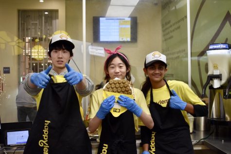 Left to right: Gavin Wang (23), Rachel Chung (24), and Suhani Chheda (25) present a matcha egg puff straight out of the waffle machine. 