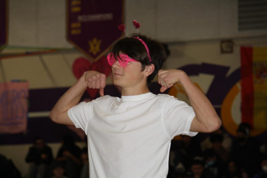 Sam Montoya (23) flexes during Mr. Amadors romantic dance performance.