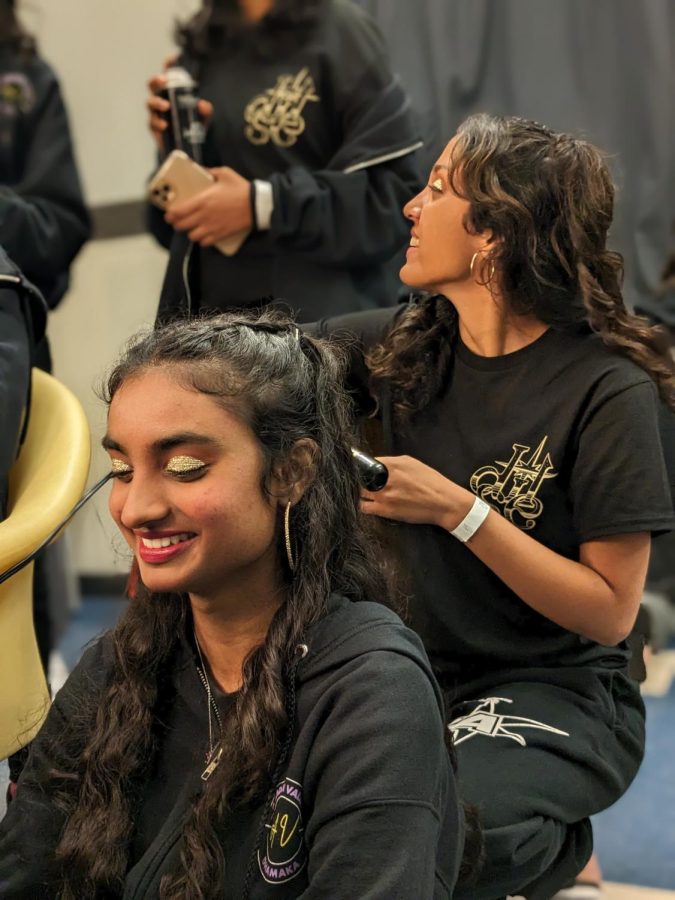 Dhwani Shetty (23) and Dipannita Aeron (24) prepare for their performance.