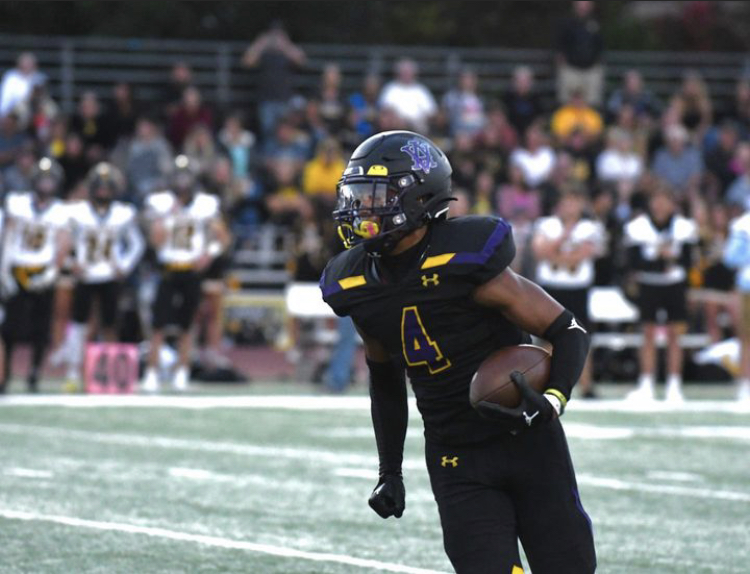 Miles Tucker (#4) carries the ball for the Amador Valley Dons during a 38-10 victory against Granada High School.