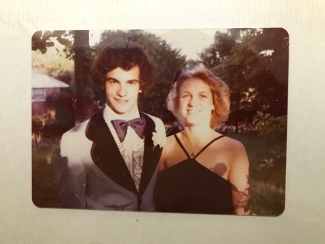 Phillip Becker, a Physics and Earth Science teacher, poses with his date before his senior ball.