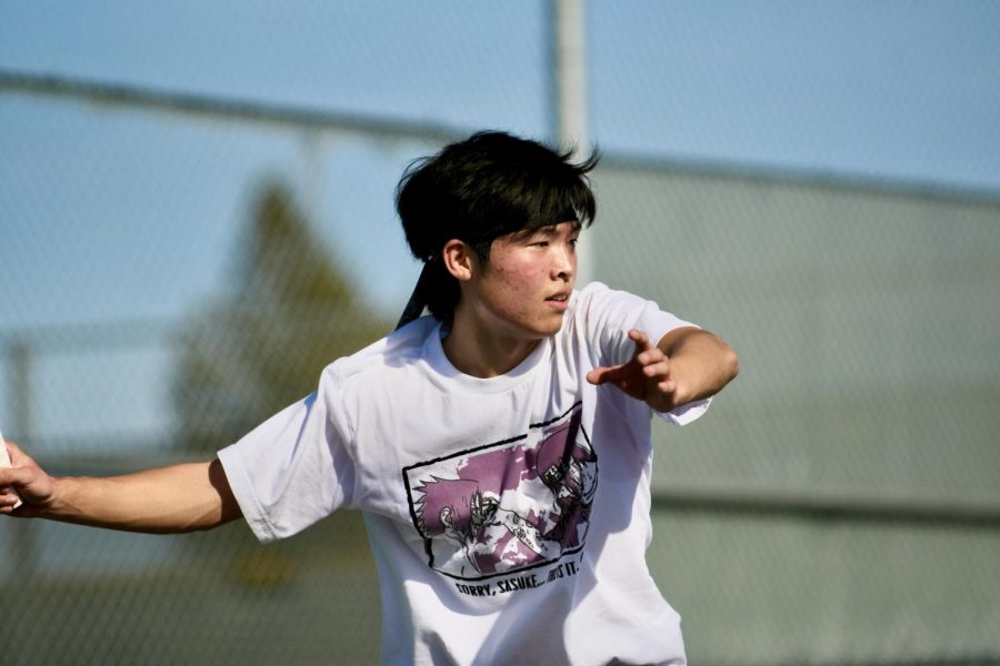 Varsity Captain Bryan Park (‘23) watches out of the ball and gets ready to pass it back to his partner. 