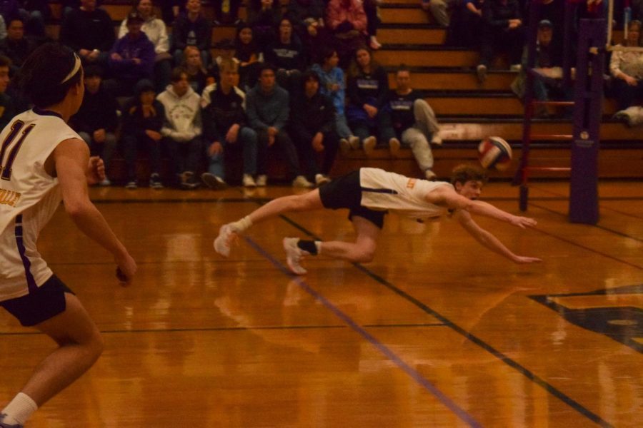 Bryce Nohava makes an incredible dive to keep the ball in play.

