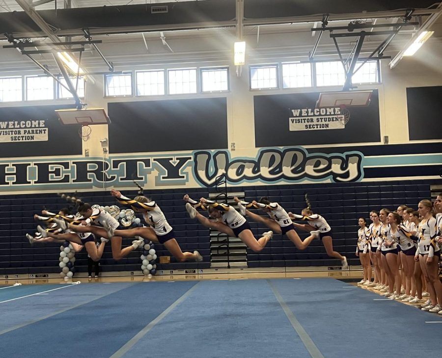 Jackie Pecavar ('25), Presley Cash ('25), and Megan Jagoe ('24) leading their level 2 tumbling routine.
