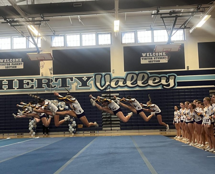 Jackie Pecavar (25), Presley Cash (25), and Megan Jagoe (24) leading their level 2 tumbling routine.